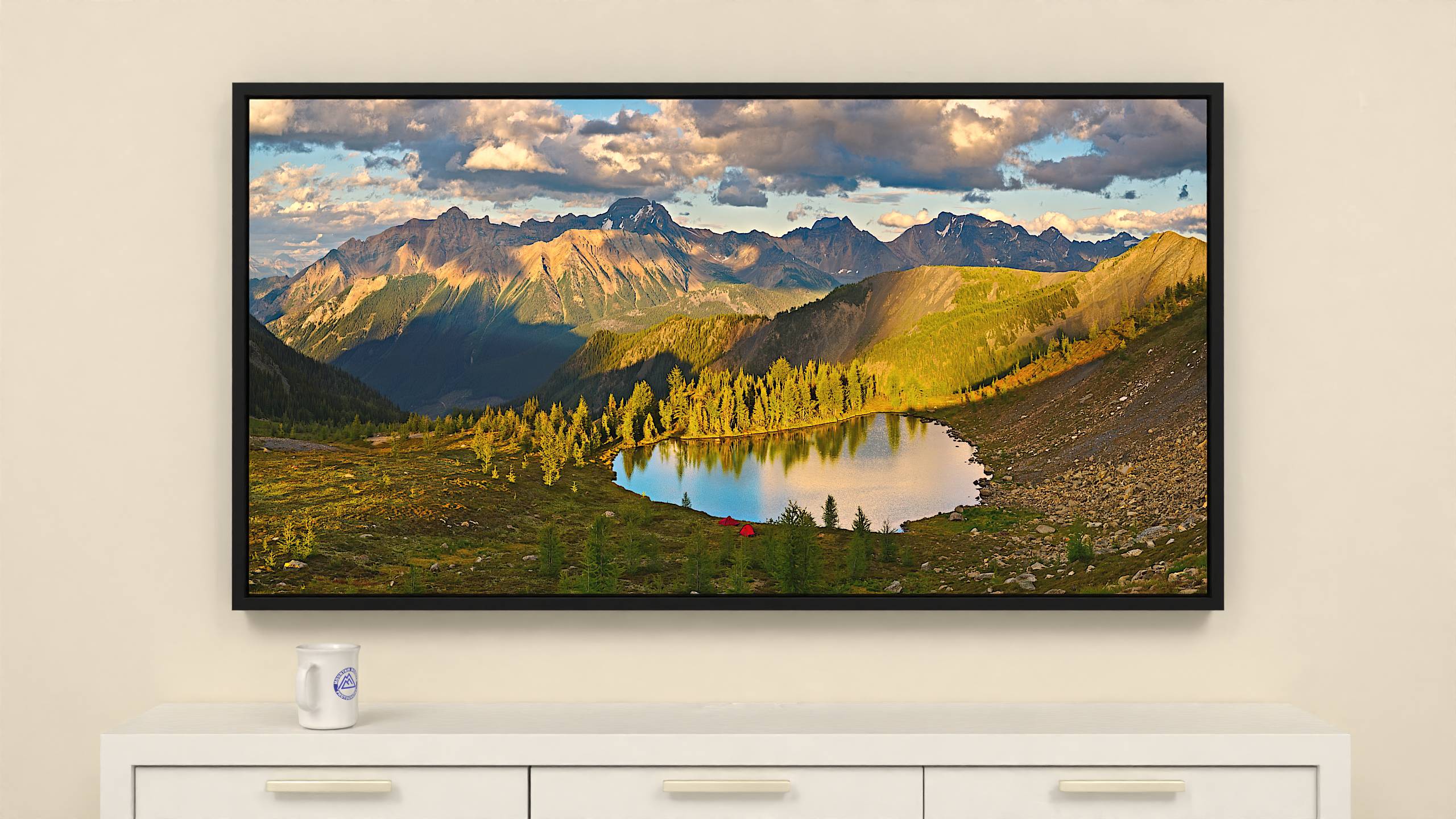 60x31 inch Wrapped canvas print with black floater frame. Vibrant alpine lake and Bugaboo mountain range evening scene on canvas print.