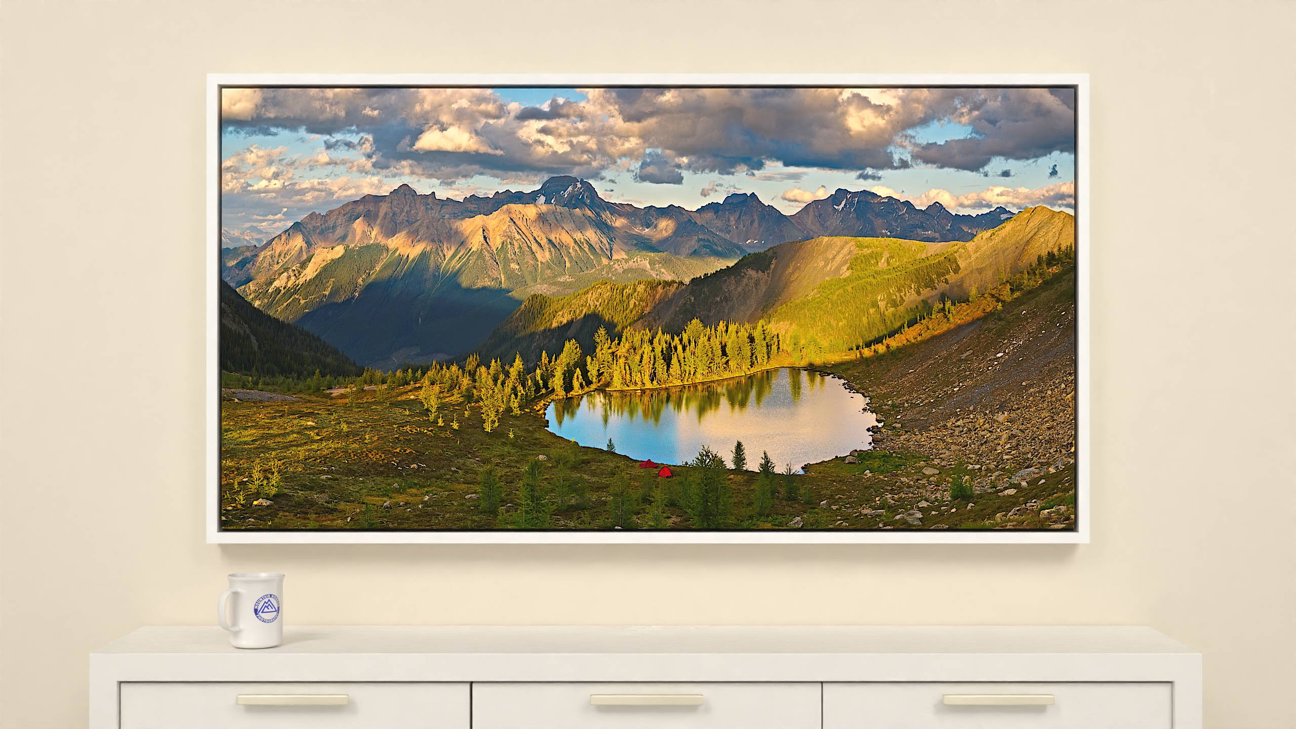 60x31 inch Wrapped canvas print with white floater frame. Vibrant alpine lake and Bugaboo mountain range evening scene on canvas print.