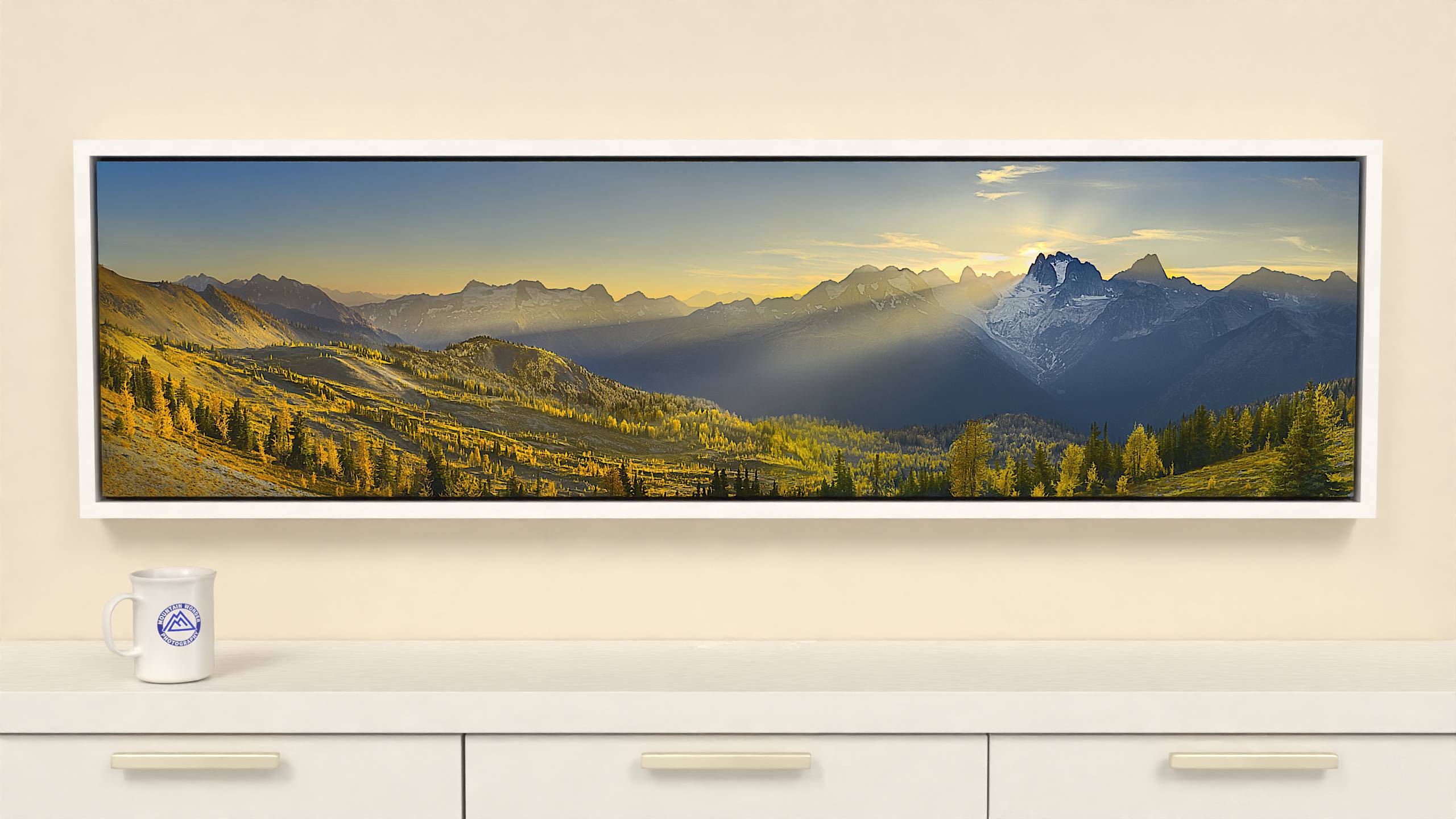 60x16 inch Wrapped canvas print with white floater frame. Capture the beauty of the Bugaboos with this panoramic canvas print featuring golden larches and majestic spires.