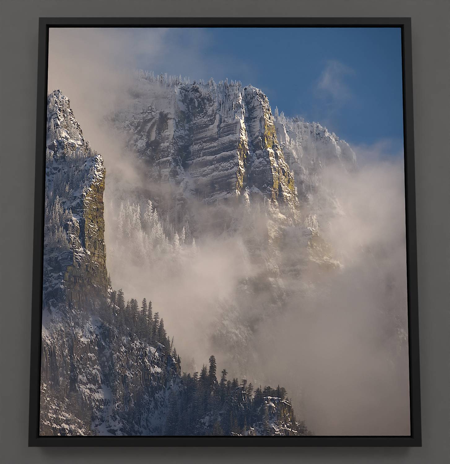 The Ramparts - Skimmerhorn range canvas: Rugged cliffs, conifers, and winter beauty